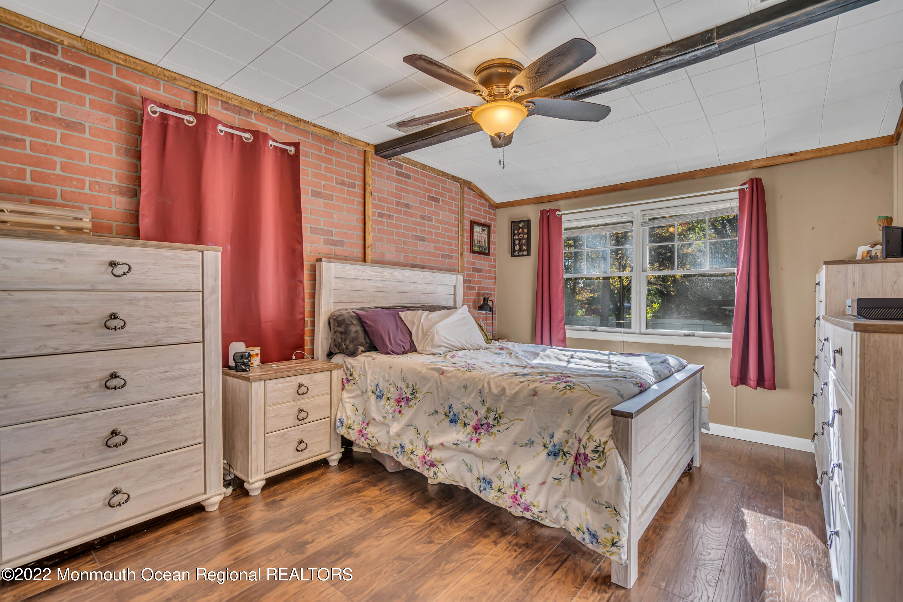 415 Shady Lane Howell, NJ 07731 - Photo 10 of 20 a bedroom with a bed and a chandelier