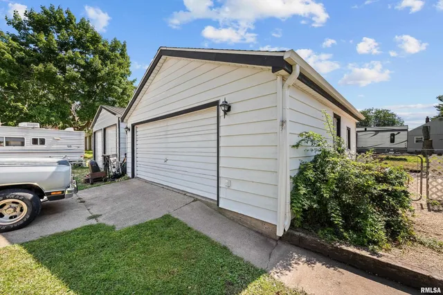 a view of a house with a backyard space