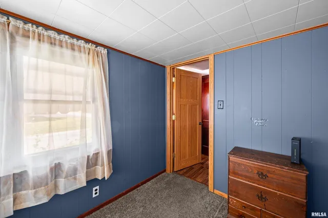 a room that has a bed and a window