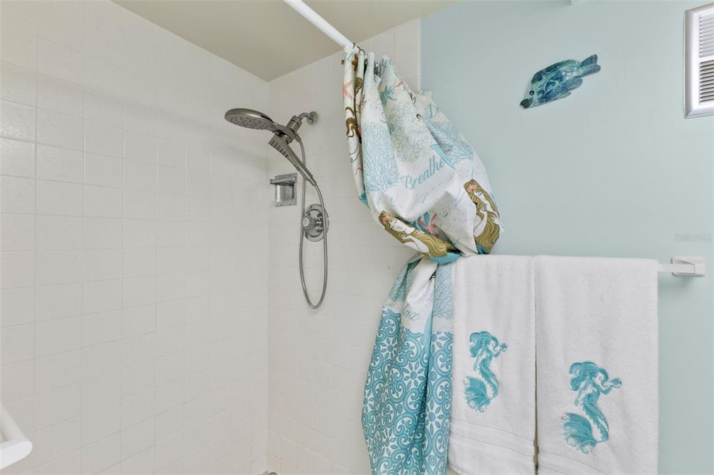 4550 Cove Circle, Unit 501 St. Petersburg, FL 33708 - Photo 23 of 44 a bathroom with a shower and a shower