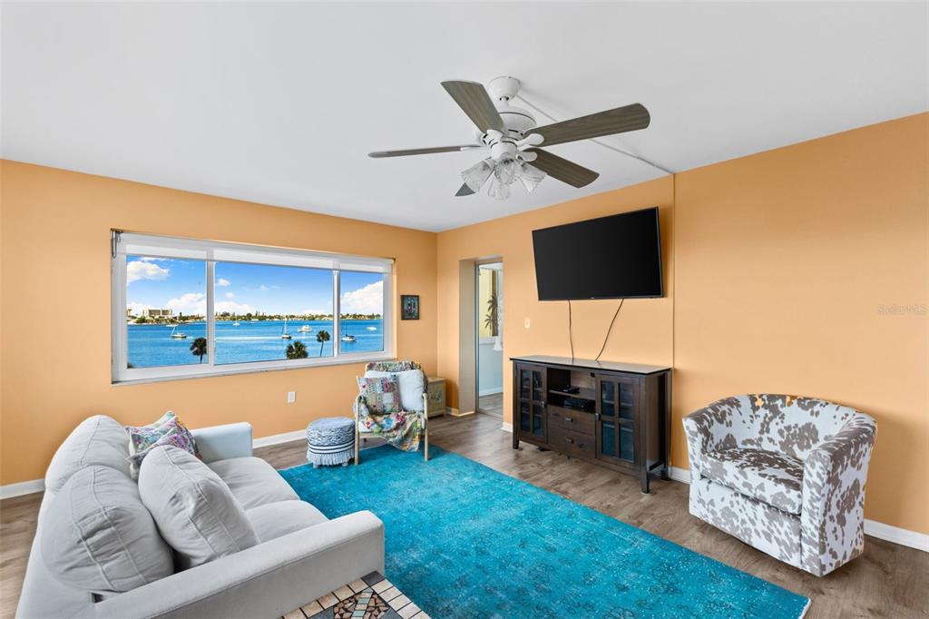 4550 Cove Circle, Unit 501 St. Petersburg, FL 33708 - Photo 24 of 44 a living room with furniture and a fireplace