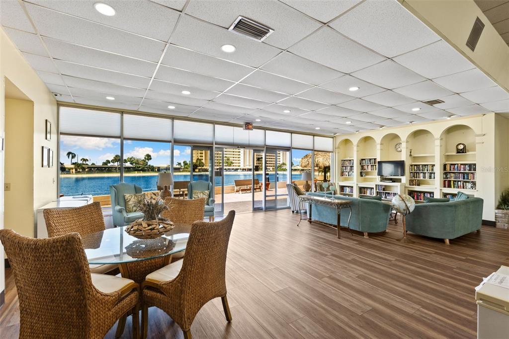 4550 Cove Circle, Unit 501 St. Petersburg, FL 33708 - Photo 25 of 44 a view of a dining room with furniture window and outside view