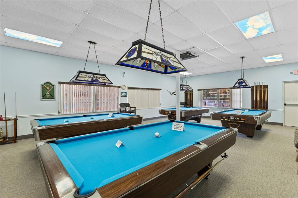 4550 Cove Circle, Unit 501 St. Petersburg, FL 33708 - Photo 27 of 44 a room with furniture pool table and window