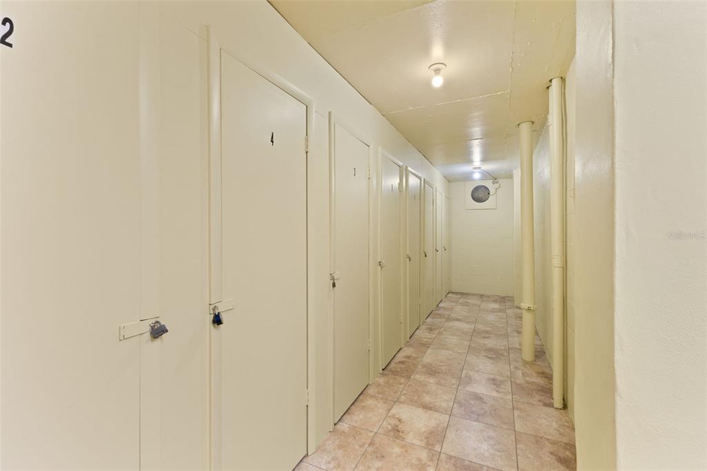 4550 Cove Circle, Unit 501 St. Petersburg, FL 33708 - Photo 38 of 44 a bathroom with a glass shower door