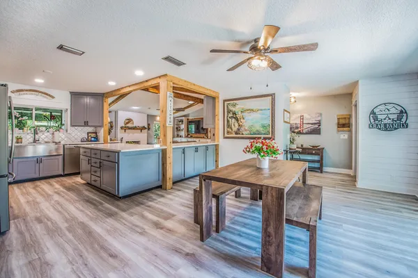 a view of a dining room with furniture window and wooden floor