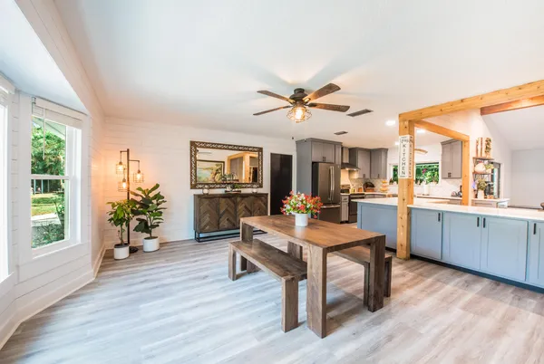 a view of a dining room with furniture window and wooden floor