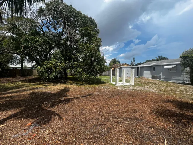 a backyard of a house with lots of green space