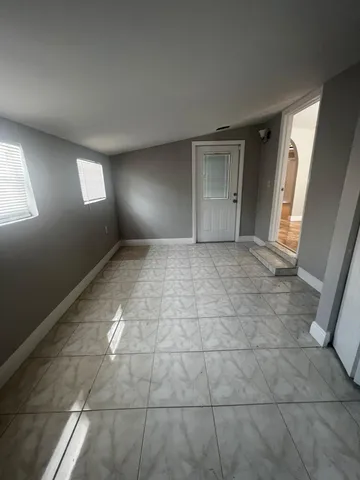 a view of an empty room and window