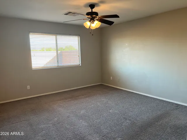 wooden floor and window in an empty room