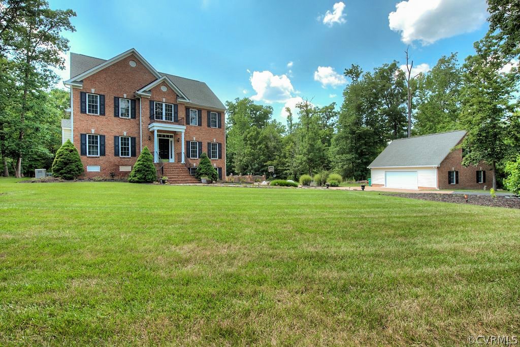 13340 Eppes Falls Road Chesterfield, VA 23838 - Photo 1 of 50 a front view of a house with garden