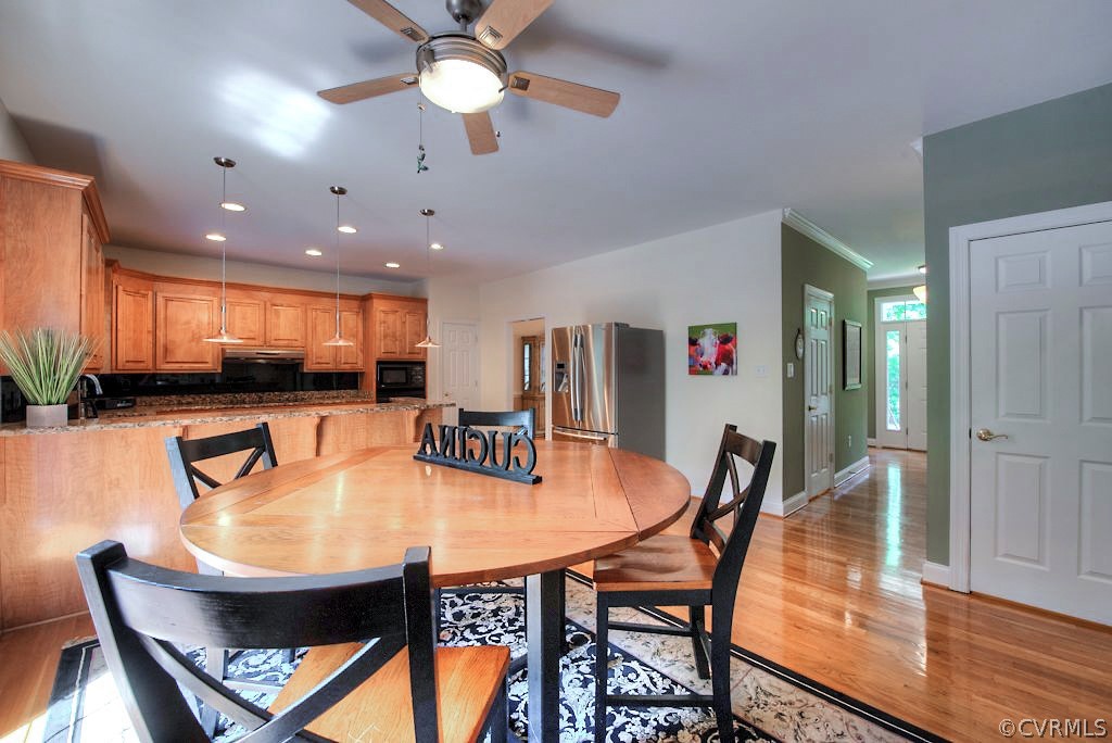 13340 Eppes Falls Road Chesterfield, VA 23838 - Photo 16 of 50 a dining room with furniture and a kitchen view