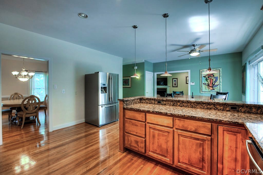 13340 Eppes Falls Road Chesterfield, VA 23838 - Photo 22 of 50 a kitchen with stainless steel appliances granite countertop wooden floors and granite counter tops
