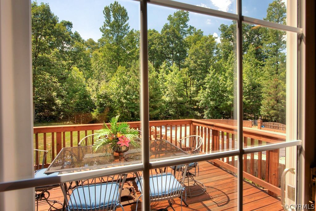 13340 Eppes Falls Road Chesterfield, VA 23838 - Photo 26 of 50 a view of a balcony with floor to ceiling windows with wooden floor