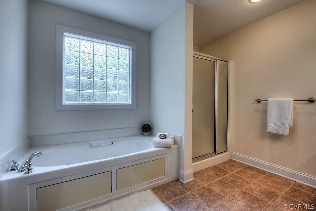 13340 Eppes Falls Road Chesterfield, VA 23838 - Photo 30 of 50 a bathroom with a tub sink and mirror