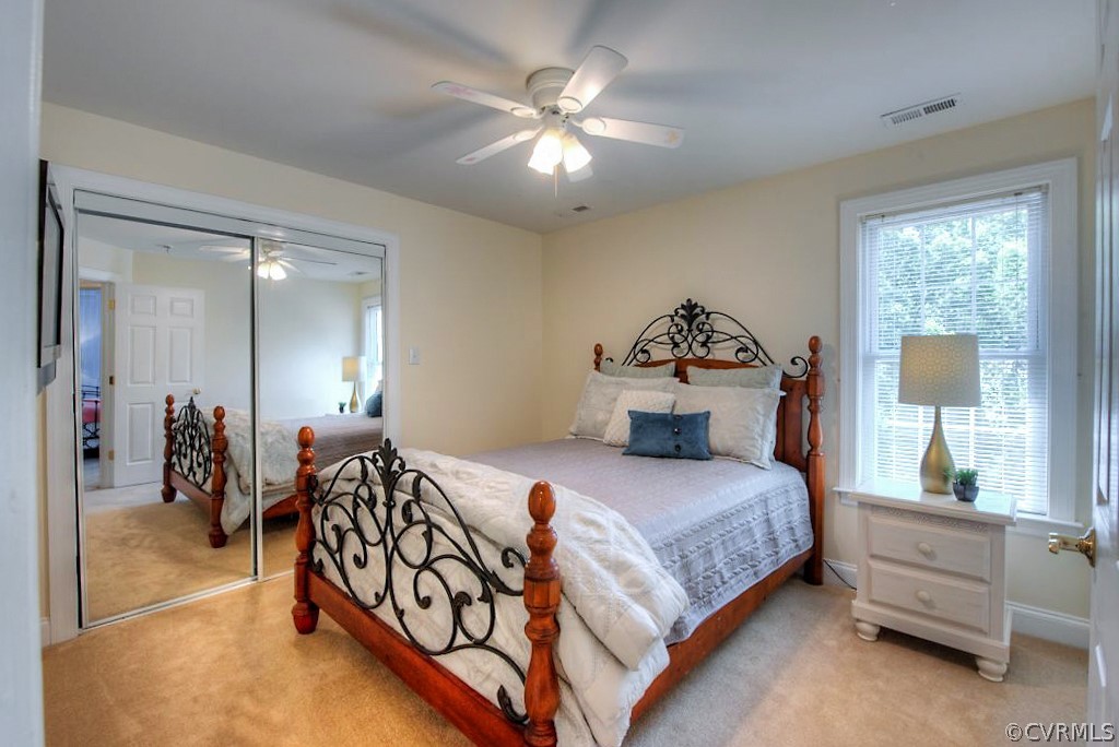 13340 Eppes Falls Road Chesterfield, VA 23838 - Photo 32 of 50 a bedroom with a bed and a chandelier