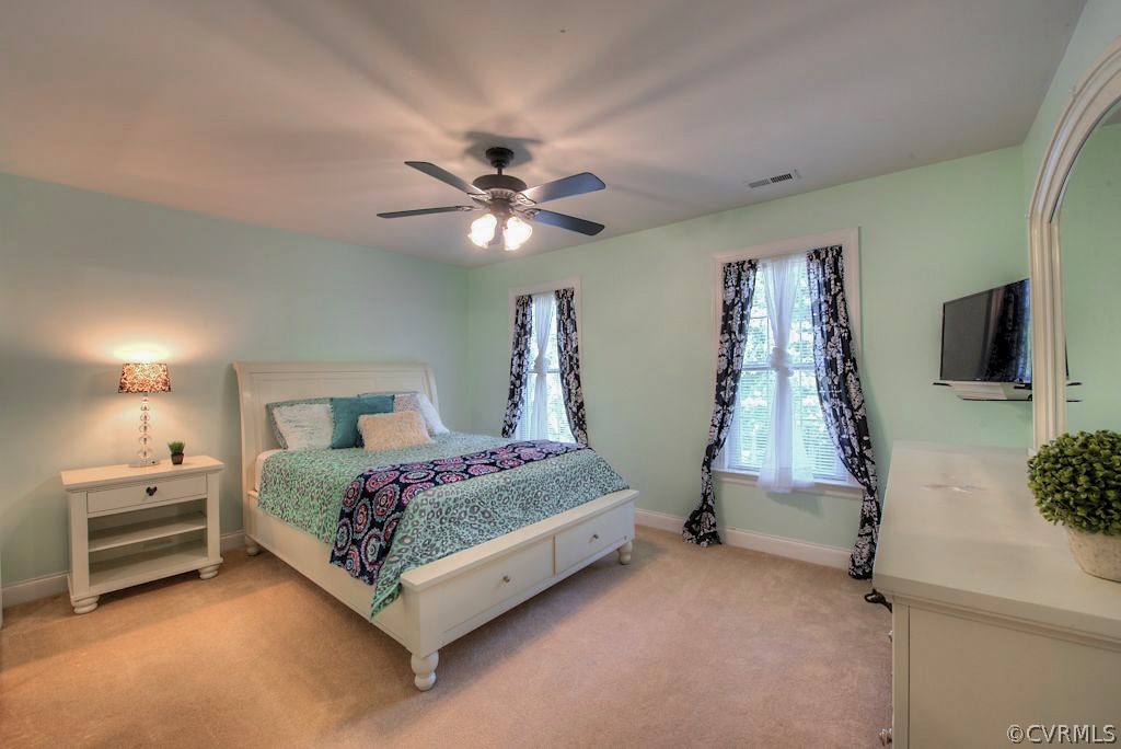 13340 Eppes Falls Road Chesterfield, VA 23838 - Photo 36 of 50 a bedroom with a bed and a flat screen tv