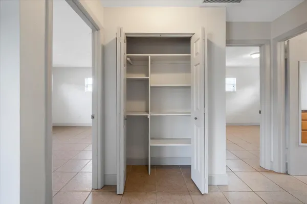 a view of a room with a wardrobe space