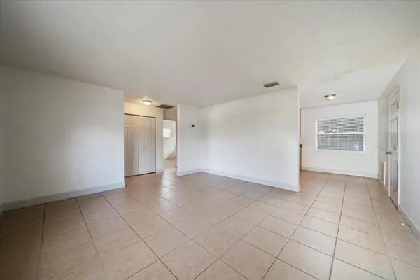 a view of an empty room with a window