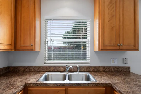 a kitchen with a sink and cabinets