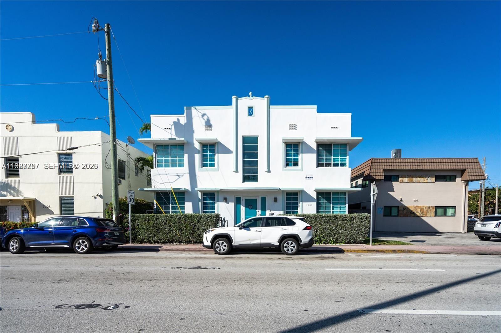 7936 Harding Avenue, Unit 5 Miami Beach, FL 33141 - Photo 2 of 6 a view of a street with cars