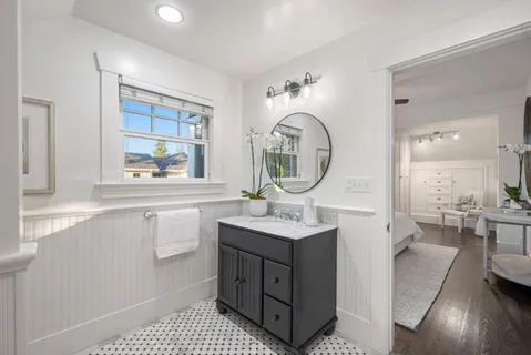 a kitchen with a sink a counter space and a window
