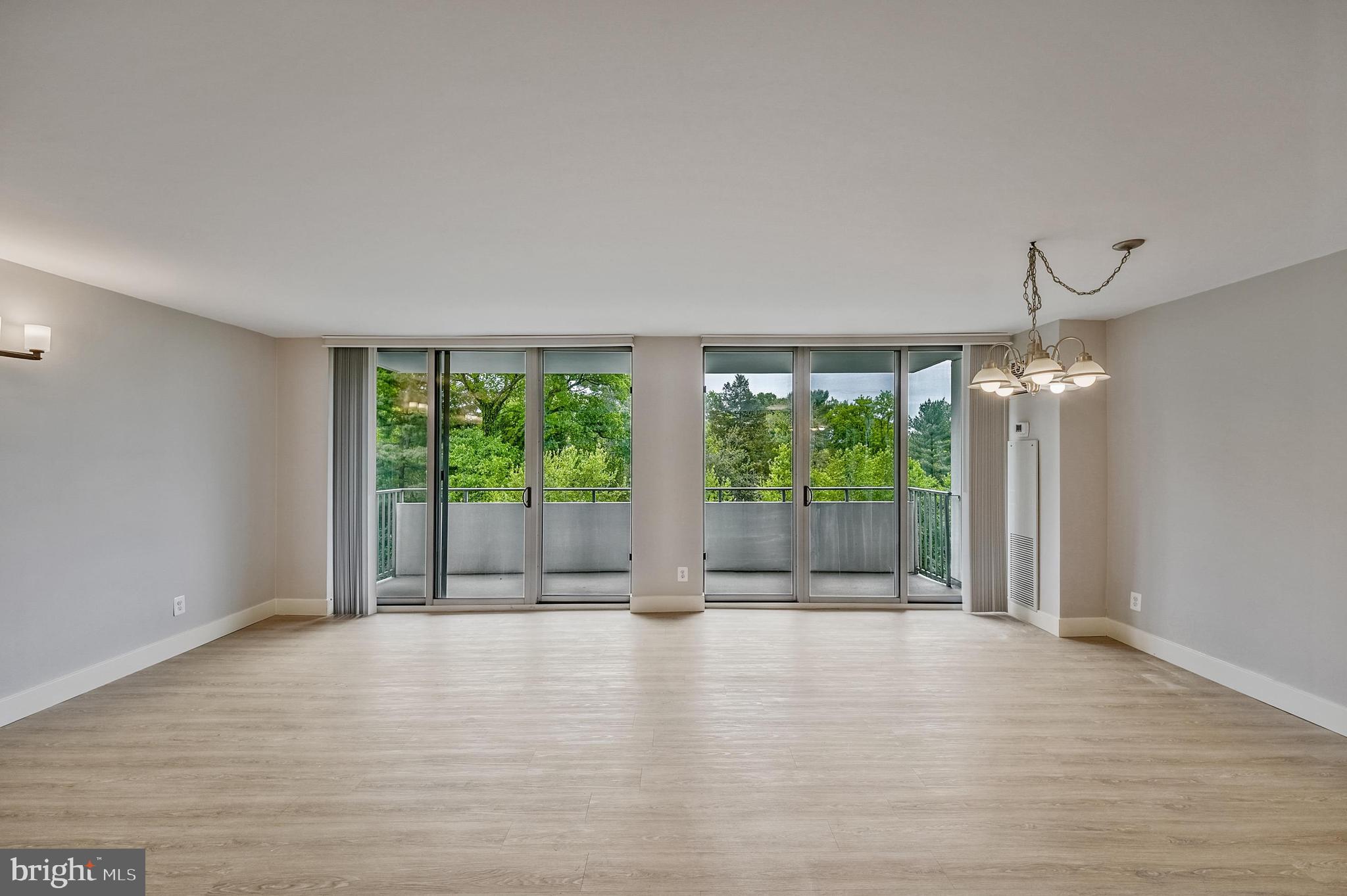 5101 River Road, Unit 1702 Bethesda, MD 20816 - Photo 7 of 38 Living Room to balcony