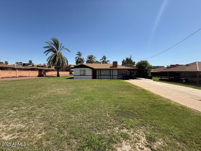 a view of a swimming pool with an outdoor seating and a yard