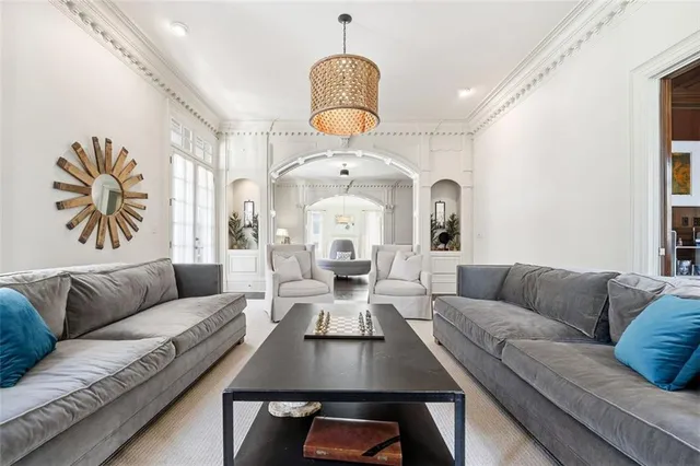 a large white kitchen with stainless steel appliances