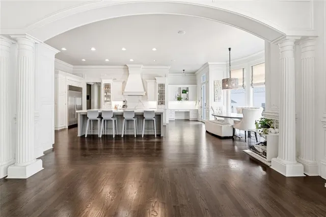 a kitchen with lots of counter top space and painting on the wall