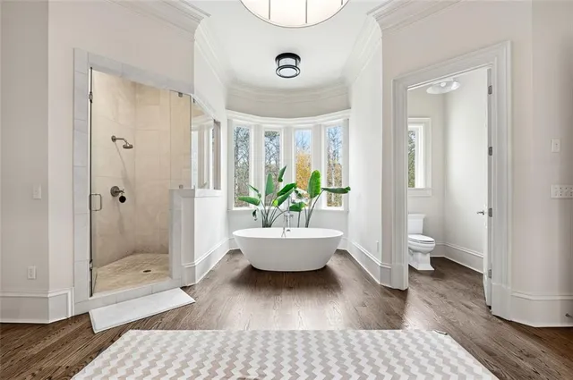 a large bathroom with a sink a large mirror and a bathtub