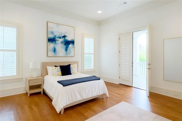 a view of a balcony with chair and floor to ceiling window