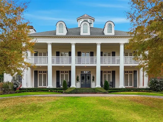 a front view of building with yard