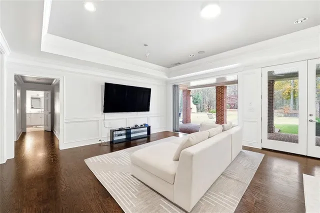 a view of empty room with wooden floor and fireplace