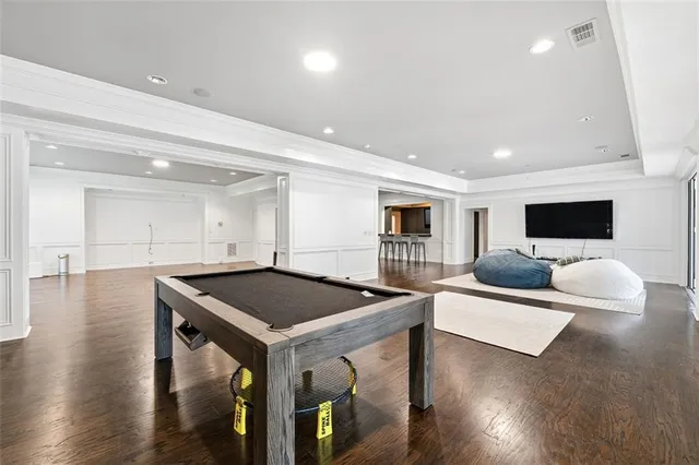a view of a porch with a table and chairs