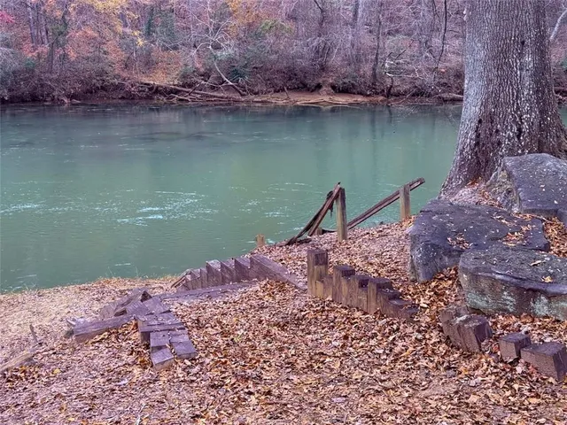 a view of lake with green space