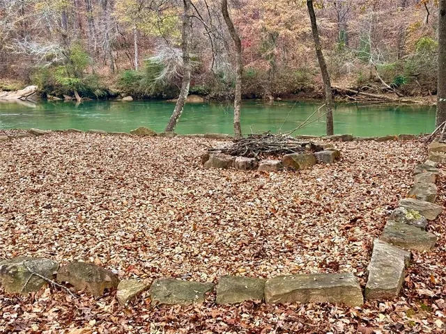 a view of a lake with a mountain in the background