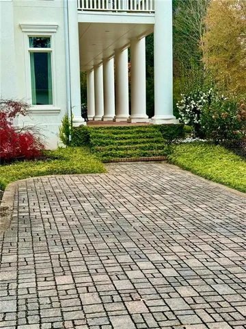 an aerial view of a house with a lake view