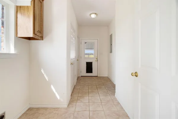 a view of a bedroom with furniture and wooden floor