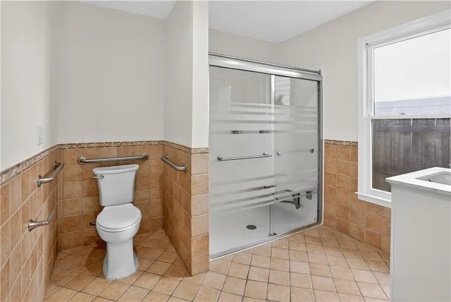 a bathroom with a toilet and a sink