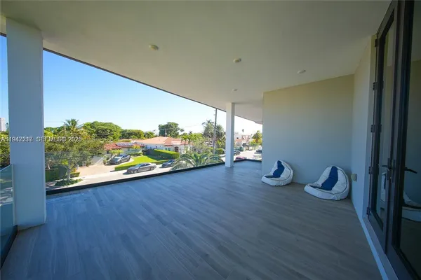 a view of a room with wooden floor and sink