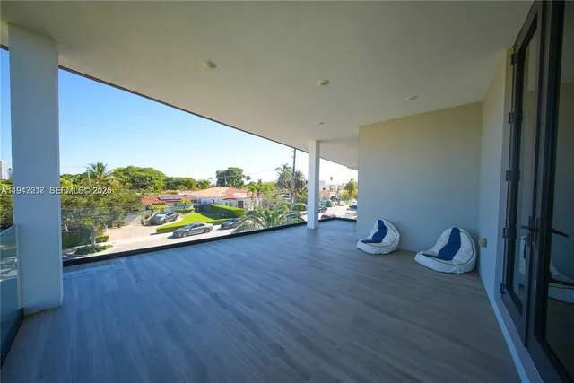 a view of a room with wooden floor and sink