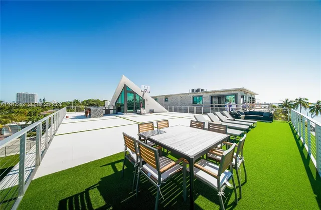 a view of a patio with swimming pool