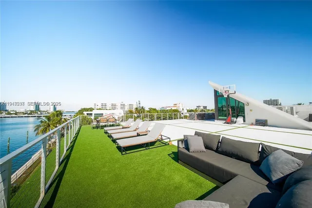 a view of a terrace with couches and city view