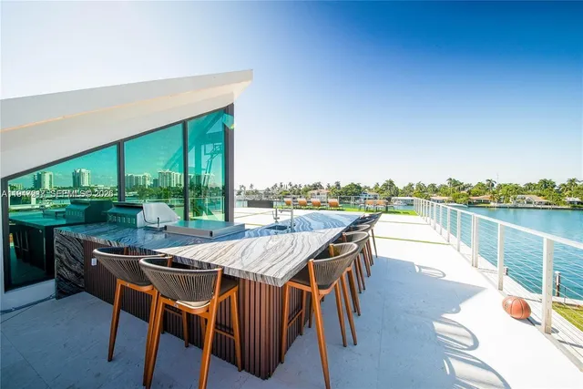 an outdoor space with furniture and garden view