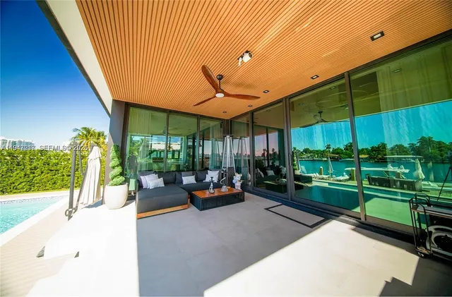 a view of a backyard with garden and patio