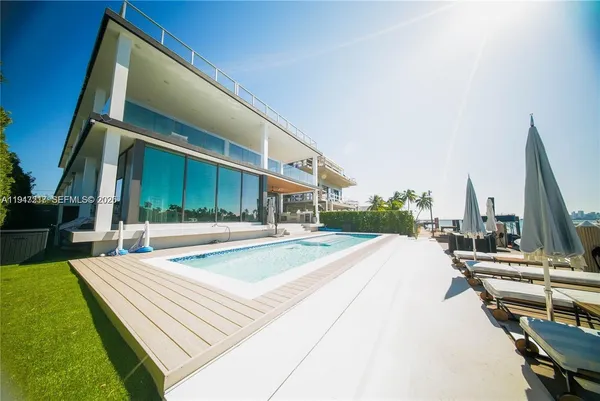 a view of a patio with a table and chairs