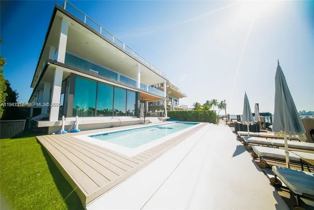 a view of a patio with a table and chairs