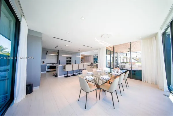 a view of a dining room with furniture window and outside view