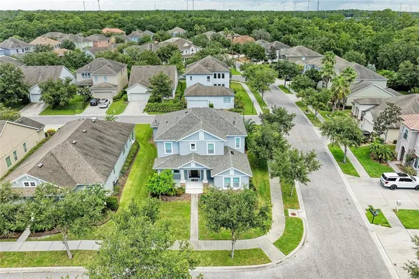an aerial view of a house with a garden and plants