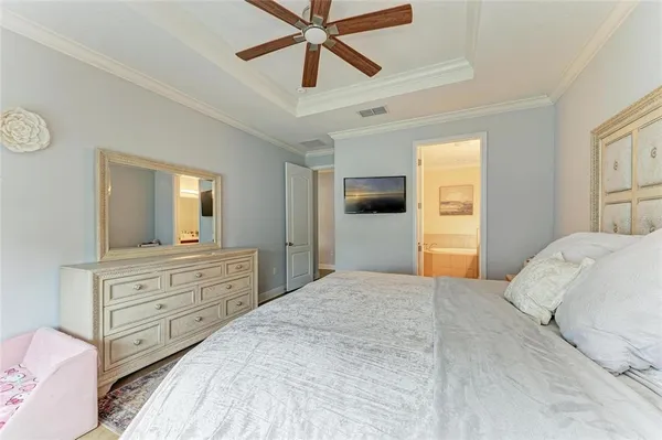 a en suite bathroom with a sink double vanity and a mirror